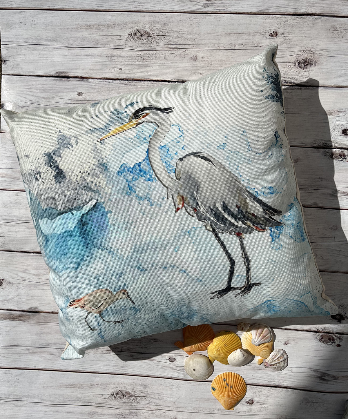 These fun outdoor throw pillows feature a blue heron and sand piper watercolor with a background created using a salt technique. Handcrafted in the USA.