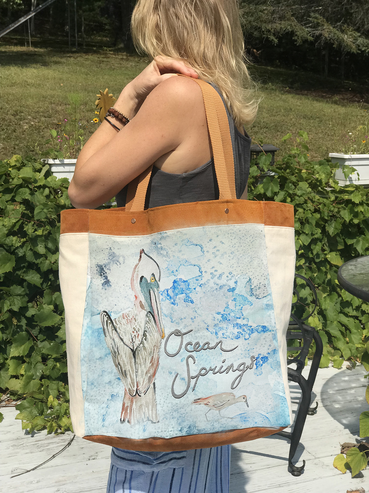 This pelican watercolor leather & canvas tote will hold everything you need for the beach and more!