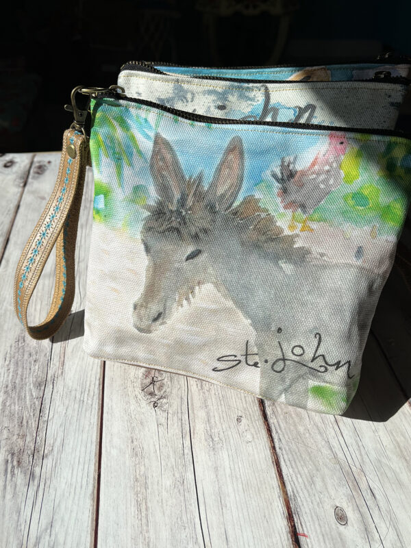 These Leather and Canvas Wristlet Bags feature a sweet baby St. John donkey. This wristlet is cotton canvas and genuine leather.